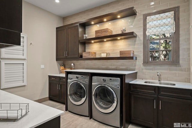 20588 Chanson Way, Reno, NV 89511 - laundry area with washer and clothes dryer, cabinet space, light tile patterned floors, baseboards, and recessed lighting