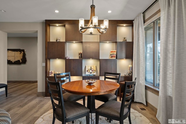 20588 Chanson Way, Reno, NV 89511 - dining area featuring baseboards, light wood-style floors, a chandelier, plenty of natural light, and recessed lighting
