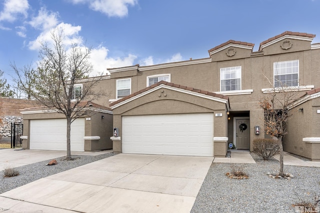 5625 Vista Luna Dr Unit 102, Sparks, NV 89436 - view of front of property featuring stucco siding, concrete driveway, and a tiled roof