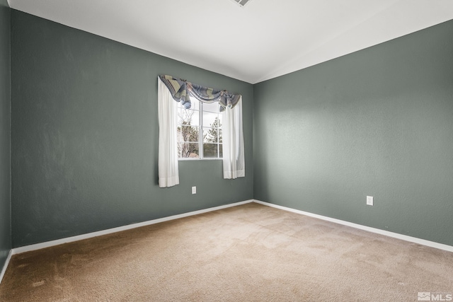 5625 Vista Luna Dr Unit 102, Sparks, NV 89436 - carpeted spare room with vaulted ceiling and baseboards