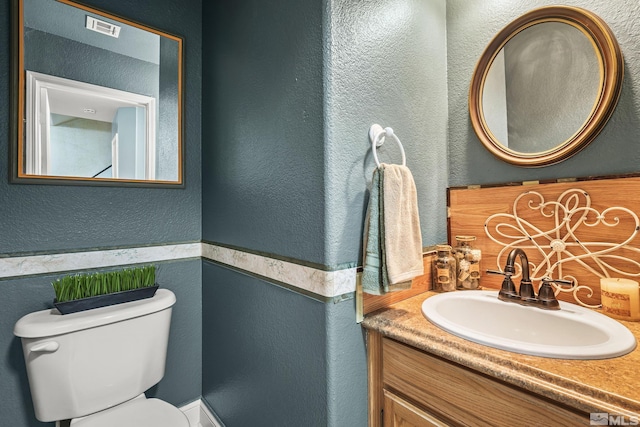 5625 Vista Luna Dr Unit 102, Sparks, NV 89436 - bathroom with a textured wall, toilet, and vanity