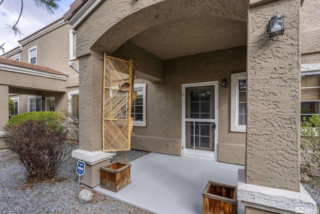 5625 Vista Luna Dr Unit 102, Sparks, NV 89436 - view of exterior entry featuring stucco siding