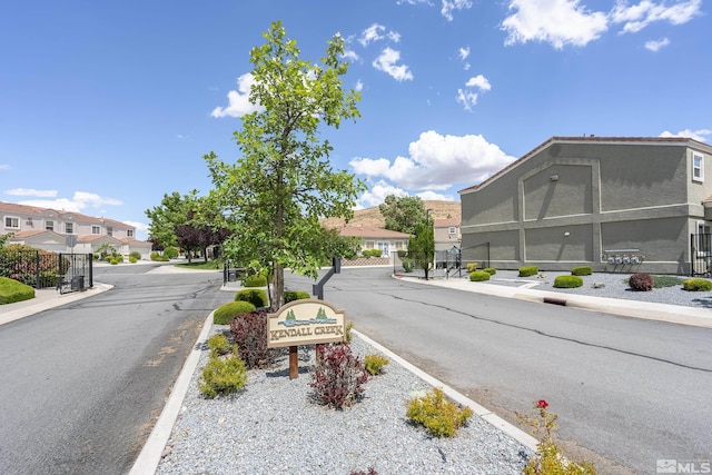 5625 Vista Luna Dr Unit 102, Sparks, NV 89436 - view of asphalt street with sidewalks, a residential view, curbs, and a gated entry