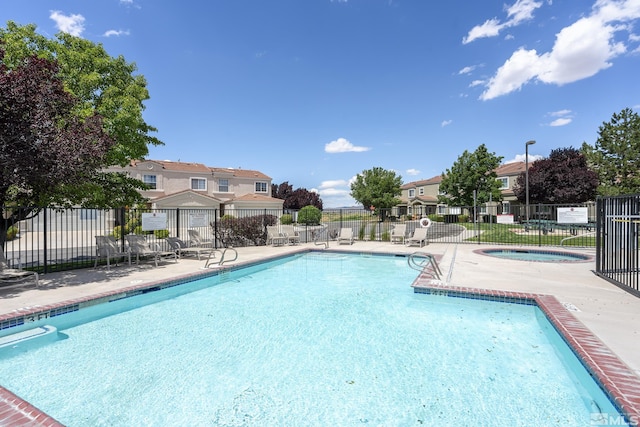 5625 Vista Luna Dr Unit 102, Sparks, NV 89436 - community pool featuring a residential view, a hot tub, fence, and a patio