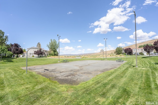 5625 Vista Luna Dr Unit 102, Sparks, NV 89436 - view of property's community with a lawn, community basketball court, and uncovered parking