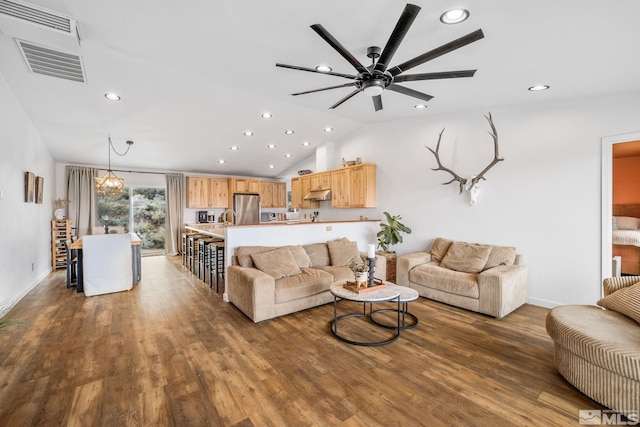 217 Shetland Cir, Reno, NV 89508 - living area featuring recessed lighting, vaulted ceiling, wood finished floors, ceiling fan, and baseboards