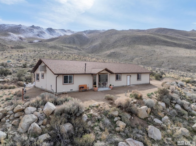 217 Shetland Cir, Reno, NV 89508 - rear view of property with a mountain view, a patio, and stucco siding