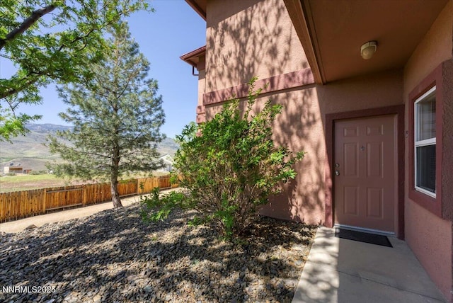 6850 Sharlands Ave Unit U1122, Reno, NV 89523 - doorway to property featuring stucco siding and a mountain view