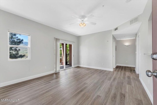6850 Sharlands Ave Unit U1122, Reno, NV 89523 - unfurnished room with wood finished floors, ceiling fan, and baseboards
