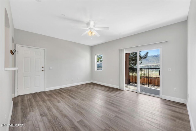 6850 Sharlands Ave Unit U1122, Reno, NV 89523 - empty room with a ceiling fan, healthy amount of natural light, and wood finished floors