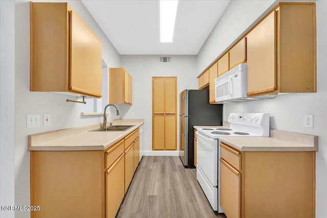 6850 Sharlands Ave Unit U1122, Reno, NV 89523 - kitchen featuring white appliances, a sink, light wood finished floors, light countertops, and light brown cabinets