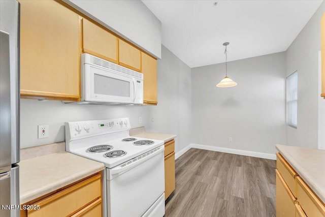 6850 Sharlands Ave Unit U1122, Reno, NV 89523 - kitchen with white appliances, light wood-style flooring, light brown cabinetry, light countertops, and pendant lighting