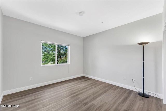6850 Sharlands Ave Unit U1122, Reno, NV 89523 - empty room with wood finished floors, baseboards, and a smoke detector