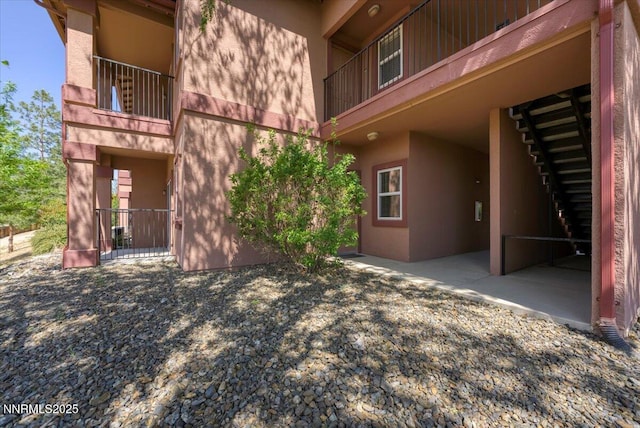 6850 Sharlands Ave Unit U1122, Reno, NV 89523 - exterior space featuring stucco siding and a balcony