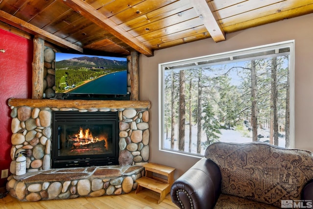 114 Angora Ct Unit A, Zephyr Cove, NV 89448 - living area with beamed ceiling, wood ceiling, hardwood / wood-style flooring, a fireplace, and plenty of natural light