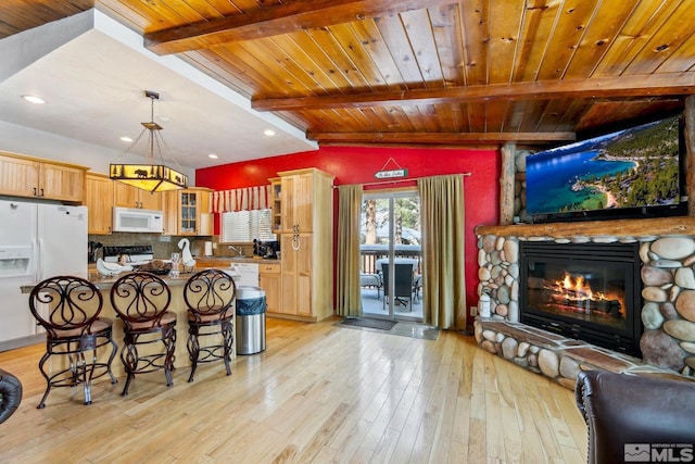 114 Angora Ct Unit A, Zephyr Cove, NV 89448 - kitchen featuring white appliances, wood ceiling, beam ceiling, a fireplace, and glass insert cabinets