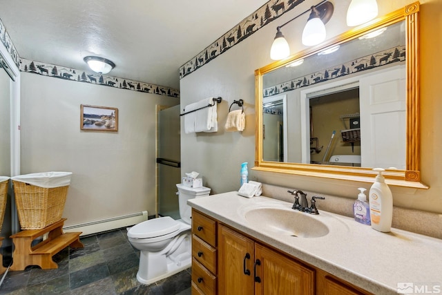 114 Angora Ct Unit A, Zephyr Cove, NV 89448 - full bathroom with a baseboard heating unit, stone finish flooring, vanity, an enclosed shower, and toilet