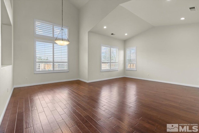 6131 Axis Dr, Sparks, NV 89436 - unfurnished room with dark wood-style flooring, vaulted ceiling, and baseboards