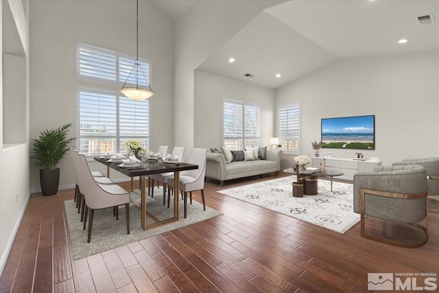6131 Axis Dr, Sparks, NV 89436 - living room with high vaulted ceiling, wood finished floors, and baseboards