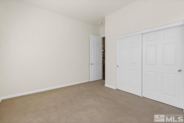 6131 Axis Dr, Sparks, NV 89436 - unfurnished bedroom with carpet, a closet, and baseboards