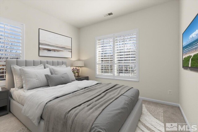 6131 Axis Dr, Sparks, NV 89436 - bedroom featuring carpet, multiple windows, and baseboards