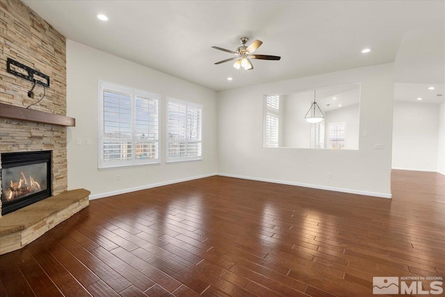 6131 Axis Dr, Sparks, NV 89436 - unfurnished living room with ceiling fan, a fireplace, hardwood / wood-style flooring, and baseboards