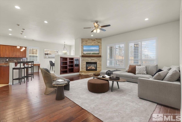 6131 Axis Dr, Sparks, NV 89436 - living area with ceiling fan, hardwood / wood-style flooring, recessed lighting, and a fireplace