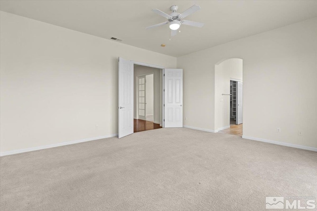 6131 Axis Dr, Sparks, NV 89436 - unfurnished room featuring light colored carpet, a ceiling fan, and baseboards