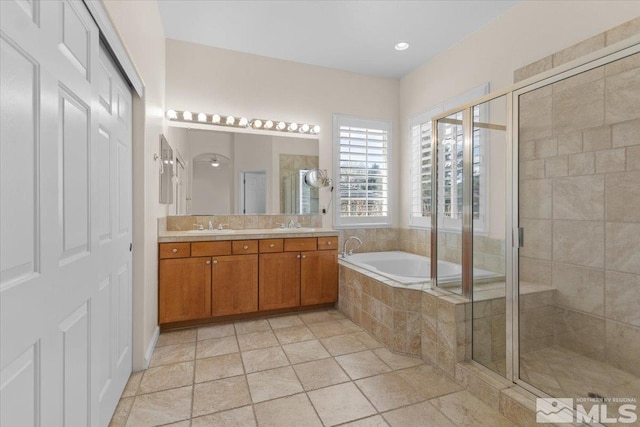6131 Axis Dr, Sparks, NV 89436 - bathroom with a stall shower, a bath, and double vanity