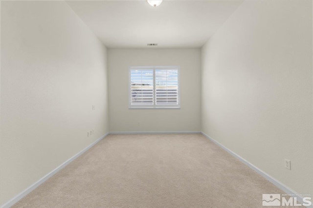 6131 Axis Dr, Sparks, NV 89436 - unfurnished room featuring light carpet and baseboards