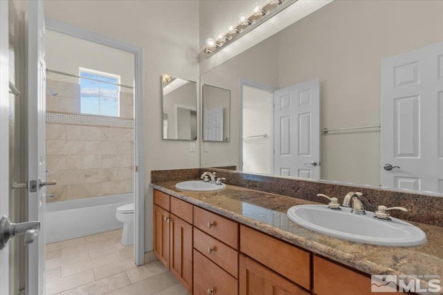 6131 Axis Dr, Sparks, NV 89436 - full bath featuring toilet, tile patterned flooring, double vanity, and shower / bath combination