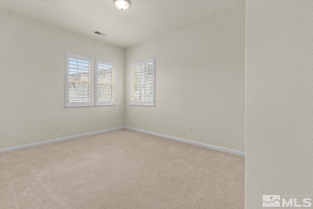 6131 Axis Dr, Sparks, NV 89436 - spare room with light carpet and baseboards