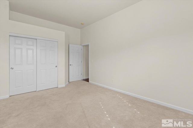 6131 Axis Dr, Sparks, NV 89436 - unfurnished bedroom featuring carpet flooring, baseboards, and a closet