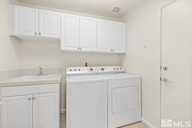 6131 Axis Dr, Sparks, NV 89436 - laundry area with independent washer and dryer and cabinet space