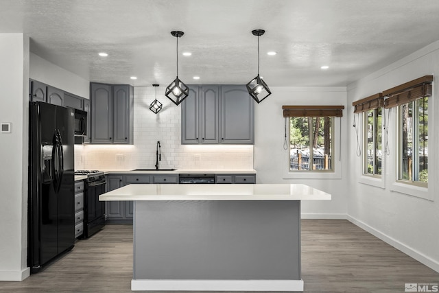820 Oriole Way Unit 51, Incline Village, NV 89451 - kitchen featuring black appliances, gray cabinets, a sink, decorative backsplash, and recessed lighting