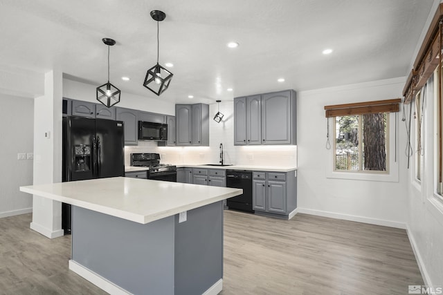 820 Oriole Way Unit 51, Incline Village, NV 89451 - kitchen featuring gray cabinetry, black appliances, a sink, backsplash, and baseboards