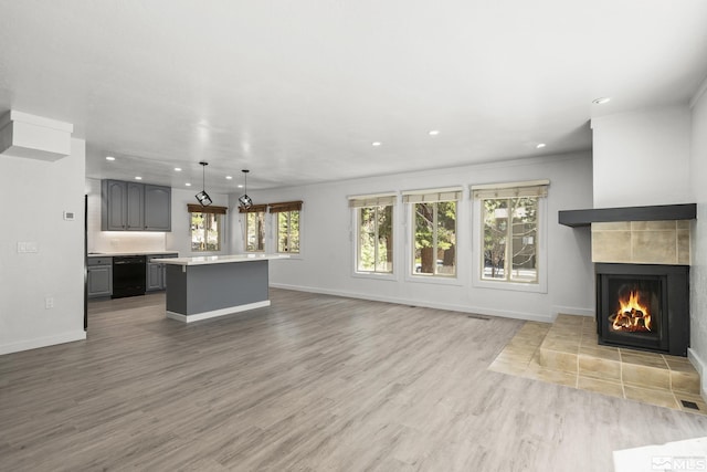 820 Oriole Way Unit 51, Incline Village, NV 89451 - unfurnished living room with a fireplace, recessed lighting, baseboards, and wood finished floors