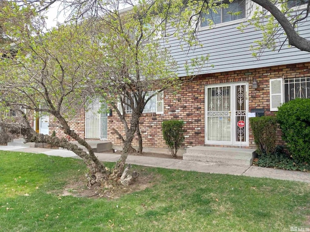 115 Smithridge Park, Reno, NV 89502 - entrance to property featuring brick siding and a lawn
