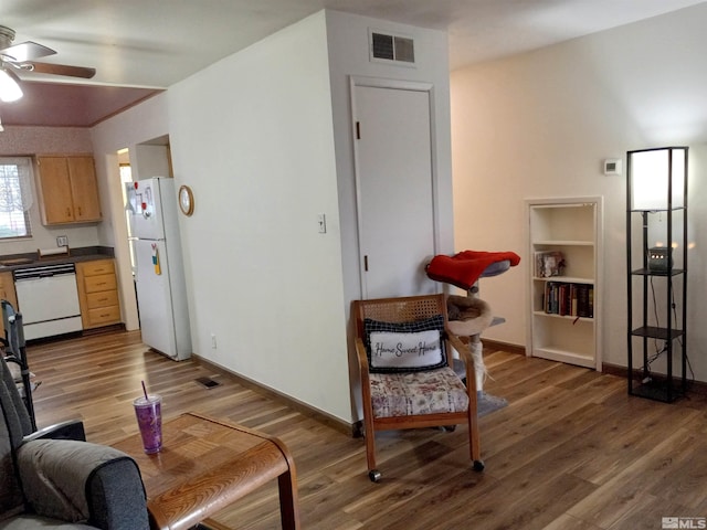 115 Smithridge Park, Reno, NV 89502 - living room with a ceiling fan, wood finished floors, baseboards, and built in shelves