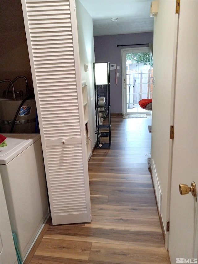 115 Smithridge Park, Reno, NV 89502 - hall featuring wood finished floors, washer / clothes dryer, and baseboards