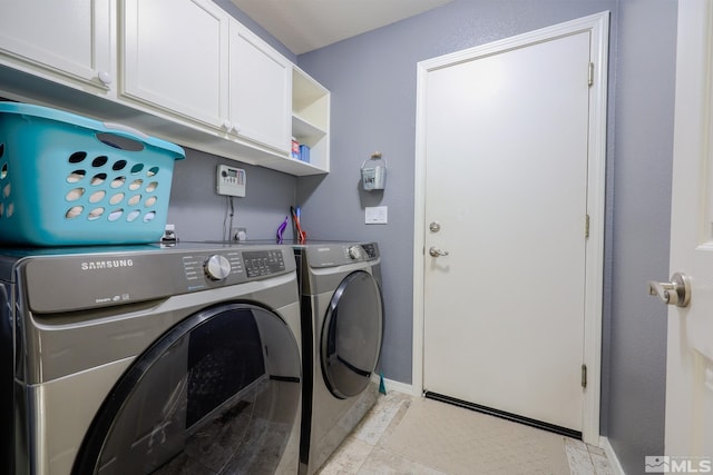 1056 Greenwing Dr, Sparks, NV 89441 - washroom featuring washer and clothes dryer, cabinet space, and baseboards
