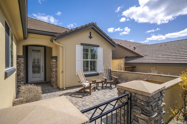 view of patio featuring fence