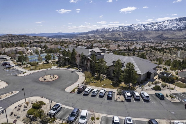 aerial view of property and surrounding area with mountains