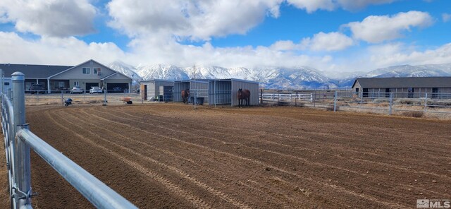 1720 N Benton Rd, Minden, NV 89423 - view of outdoor structure featuring a mountain view, fence, and an outbuilding