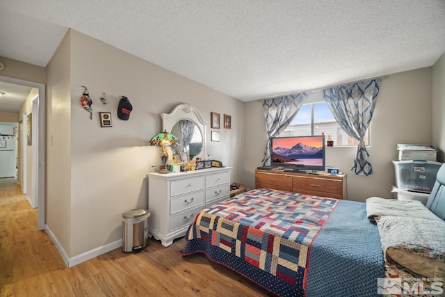 1672 Sue Way, Sparks, NV 89431 - bedroom featuring light wood-style flooring, a textured ceiling, and baseboards