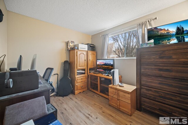 1672 Sue Way, Sparks, NV 89431 - office space featuring light wood-style floors and a textured ceiling