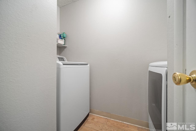 1672 Sue Way, Sparks, NV 89431 - clothes washing area with baseboards and washing machine and clothes dryer