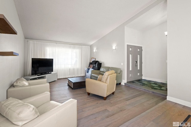 920 Pinebrook Rd, Reno, NV 89509 - living area with vaulted ceiling, wood finished floors, and baseboards
