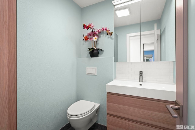 920 Pinebrook Rd, Reno, NV 89509 - half bathroom featuring tasteful backsplash, toilet, vanity, and a textured wall