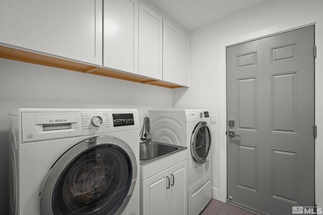 920 Pinebrook Rd, Reno, NV 89509 - washroom with washer and clothes dryer, cabinet space, and dark wood-style floors